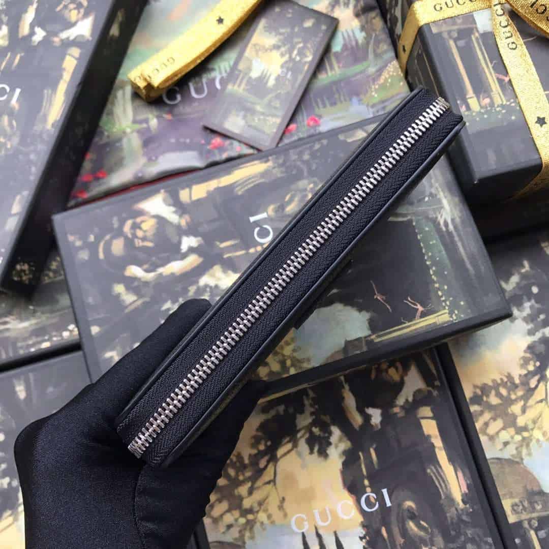 G*u*i leather zip around wallet with web